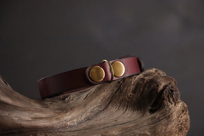 Oxblood leather cat collar with antique bronze D-ring and smooth finish.