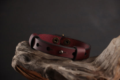 Back of oxblood leather cat collar showing functionality of front snap closure.