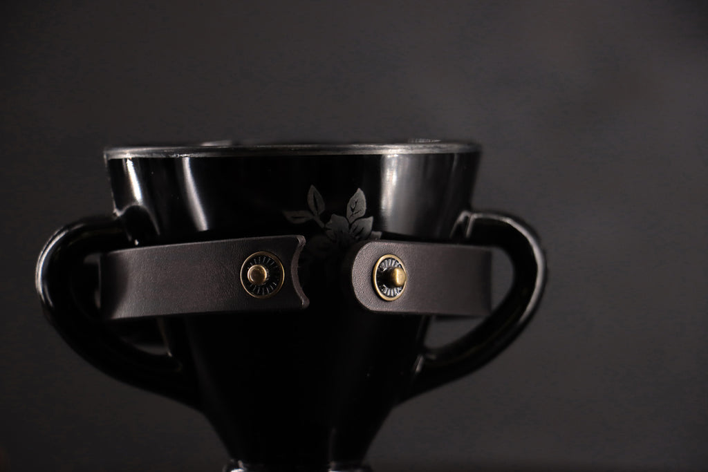Black cat collar unsnapped to show breakaway closure.