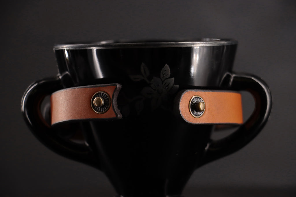 Cognac cat collar unsnapped to show breakaway closure.