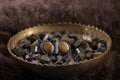 Front of cobalt leather cat ID tag charm with antique bronze D-ring.