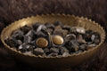 Front of black leather cat ID tag charm with antique bronze D-ring. 