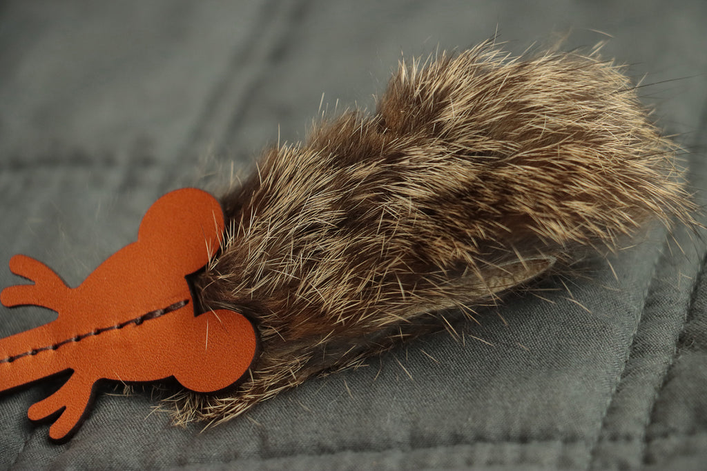 Handcrafted mouse cat toy with leather ears, whiskers, and fur body.